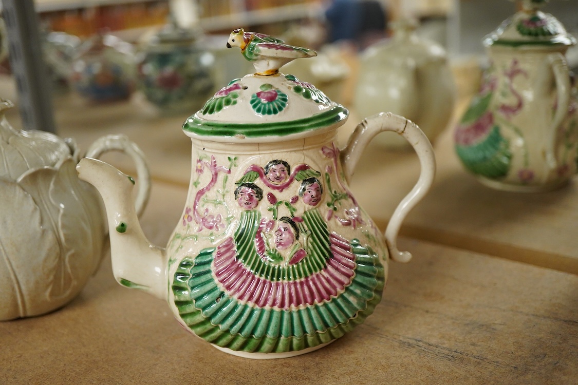 A rare Staffordshire saltglaze stoneware teapot, mid 18th century, an early 19th Wedgwood stoneware teapot and a stoneware butter tub and cover - 13cm wide (3)